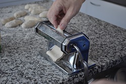 Calender a leavened dough