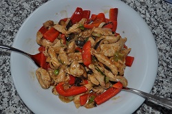 Chinese wok of chicken and peppers with flavorings