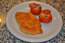 Chicken cordon bleu and baked cherry tomatoes stuffed with rice