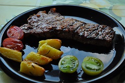 Grilled beef steak with baked potatoes