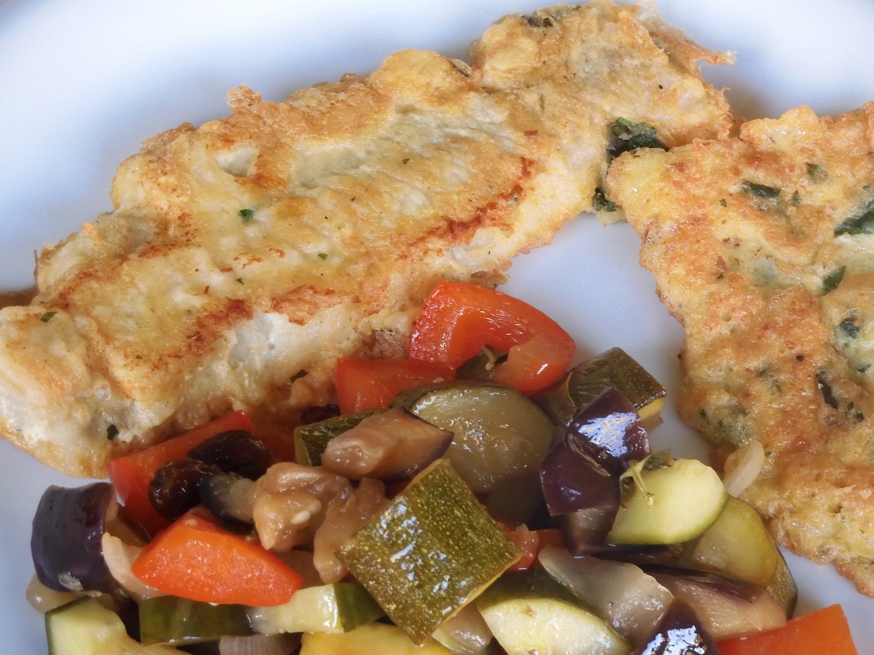 Piccata of cod fillets with sweet and sour vegetables