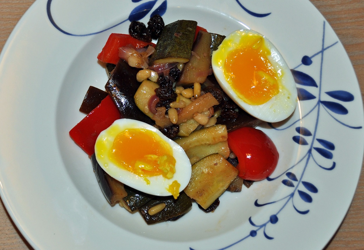 Sautéed vegetables in sweet and sour sauce with barzotte eggs